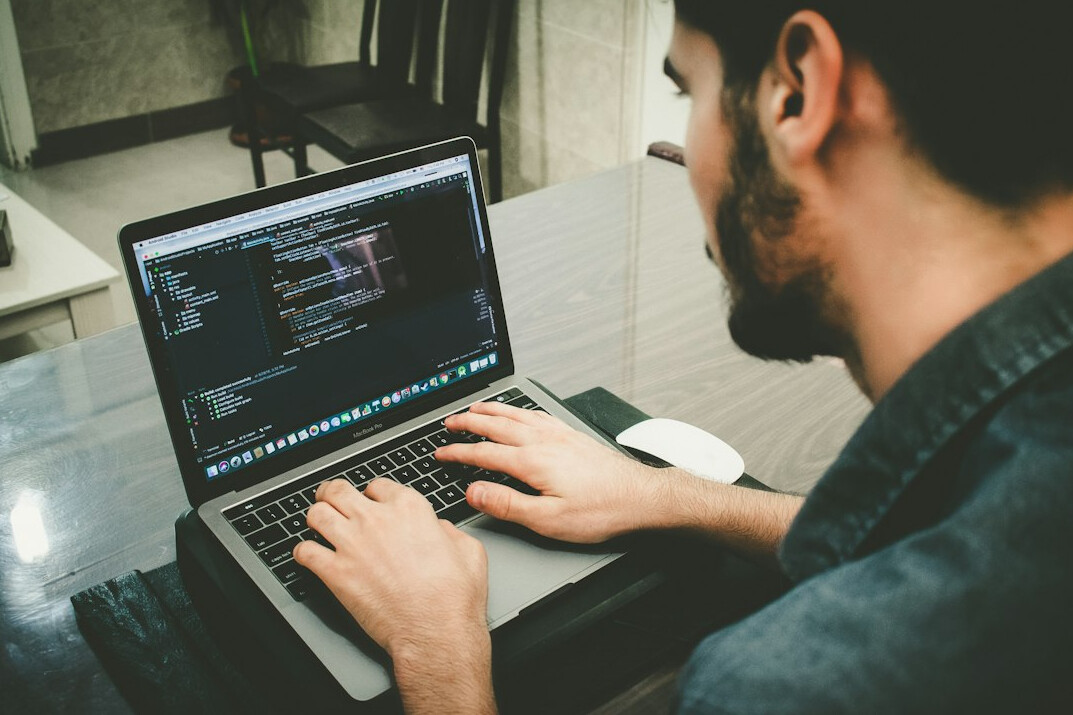 person learning programming on laptop