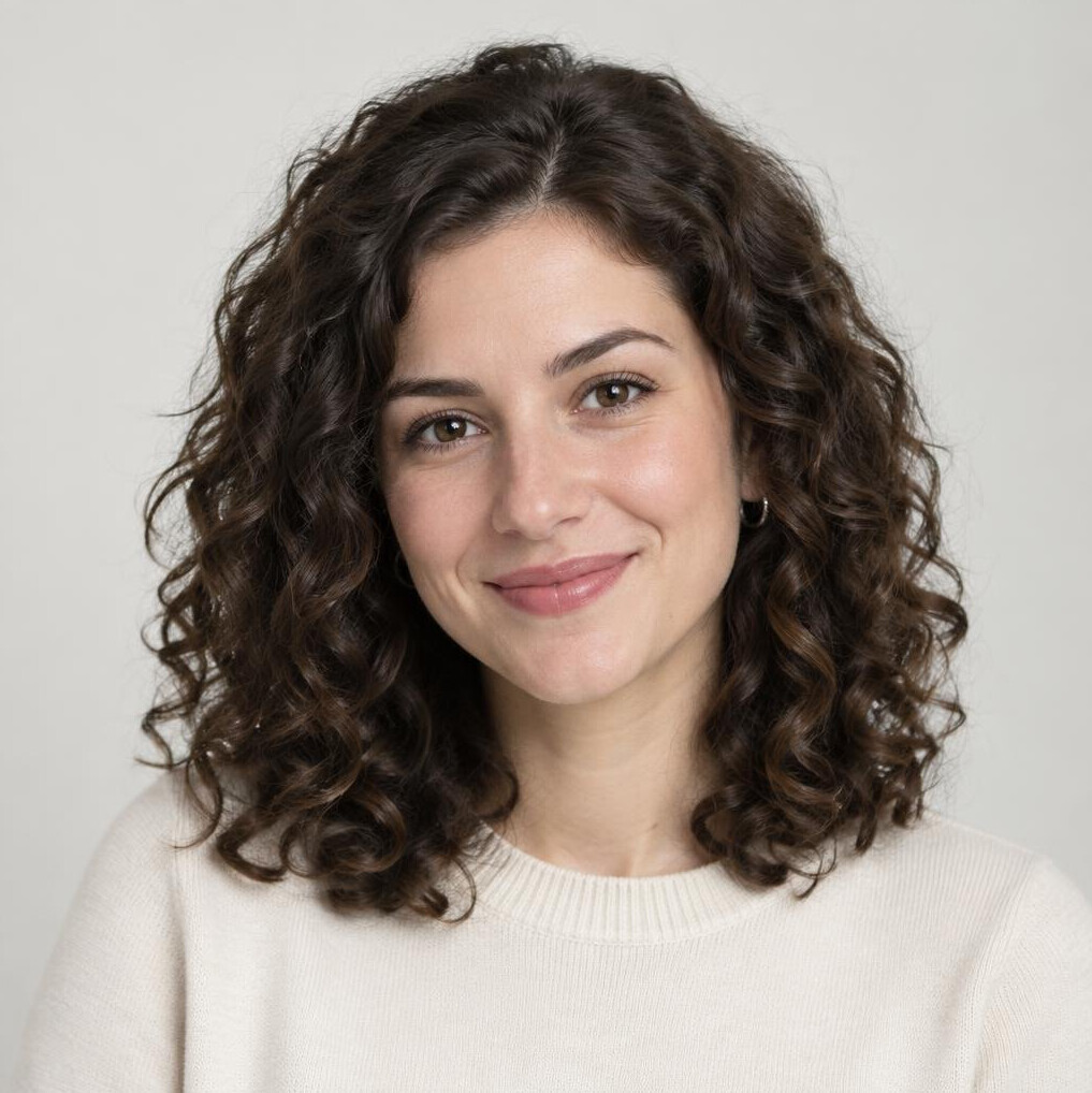 Studio portrait of a young woman with curly hair