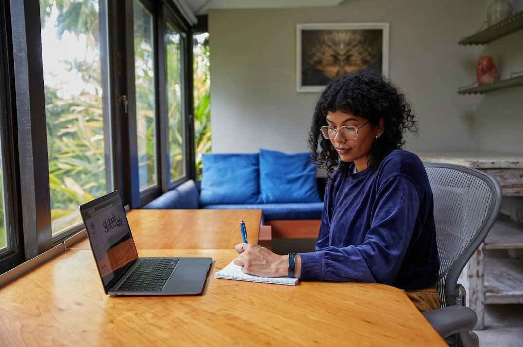 woman studying at home desk